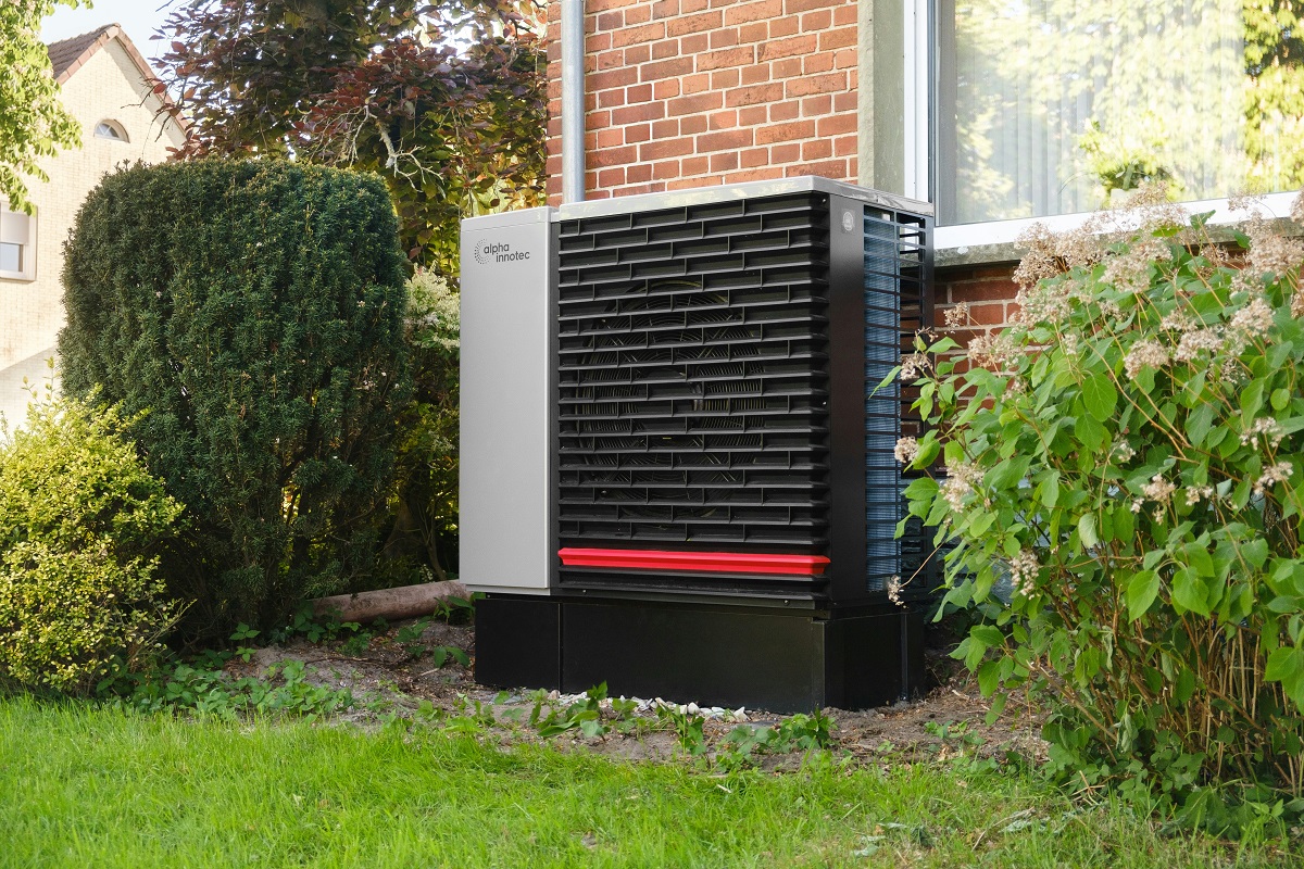 outdoor heater at the side of a brick home