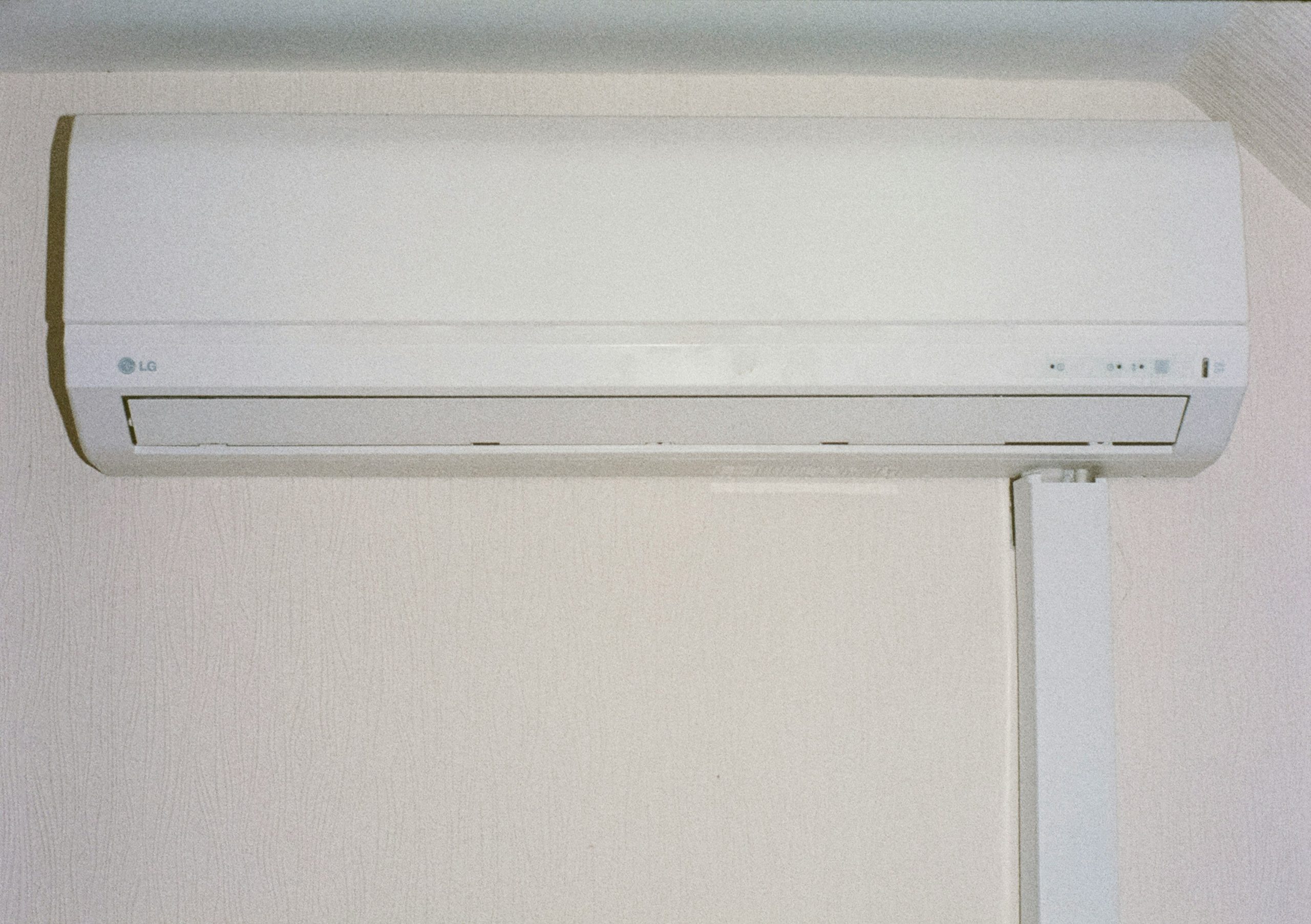 inverter air conditioner mounted on a white wall